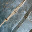 Close up of a crack in wood that needs a resin repair.